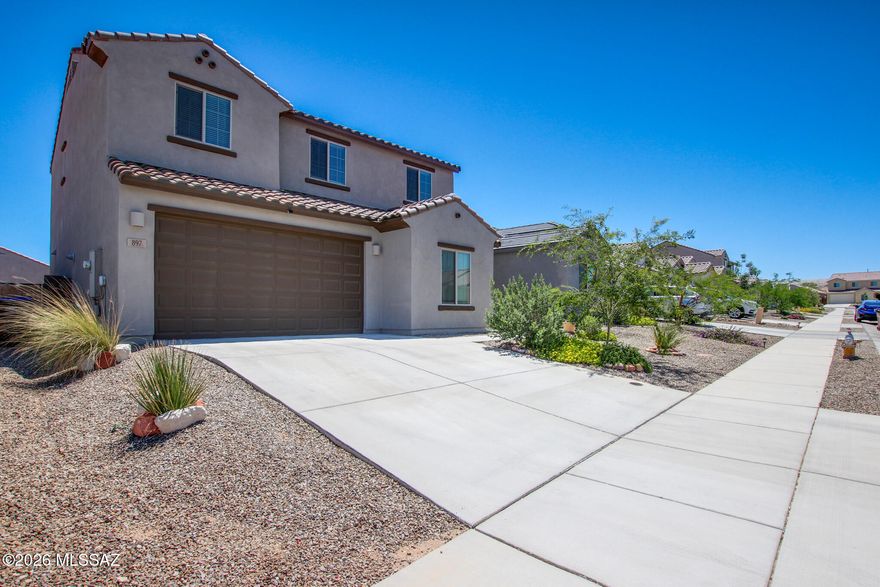 Beautifully maintained newer-built home in Rancho Sahuarita offering modern comfort & move-in-ready convenience. Versatile floor plan features a downstairs bedroom & full bath, ideal for guests, office, or flex space. Bright open-concept living flows into a stylish kitchen with Whirlpool appliances, abundant cabinetry & walk-in pantry. Upstairs offers a spacious loft, laundry room, relaxing primary suite with mountain views, plus two additional bedrooms. Backyard is ready for your personal touch. Includes refrigerator, washer, dryer & two-car garage. Enjoy Rancho Sahuarita amenities including multiple community clubs, pools, jacuzzis, Sahuarita Lake, walking paths, green parks & moreâ”all included in the affordable HOA.