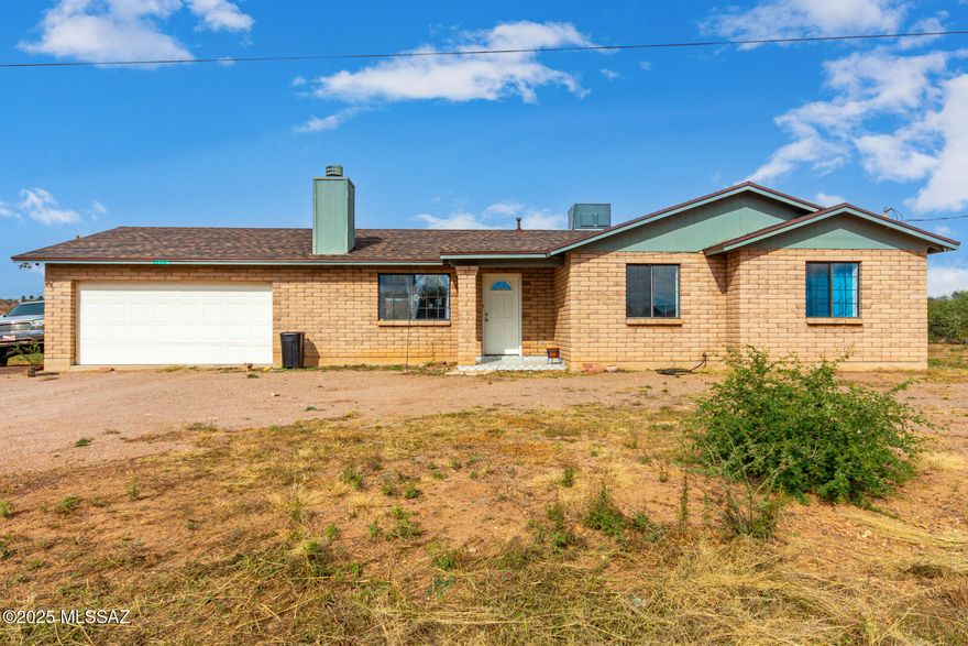 For Rent or For sale! 3 Bed / 2 Bath Ranch Home in Rio Rico - Mountain Views & Nearly Half an Acre! Escape to the beauty of the Arizona desert in this charming ranch-style home offering 1,381 Sqft of comfortable living space on nearly half an acre with stunning mountain views. Inside, you'll love the vaulted ceilings, cozy wood-burning fireplace in the living room, and an eat-in kitchen with a dishwasher, electric range, and pantry. The primary suite features a double vanity and walk-in closet. Ceramic tile and carpet throughout. Please contact owner Pablo Olson for any questions regarding the terms on the lease agreement- 520-415-4494
