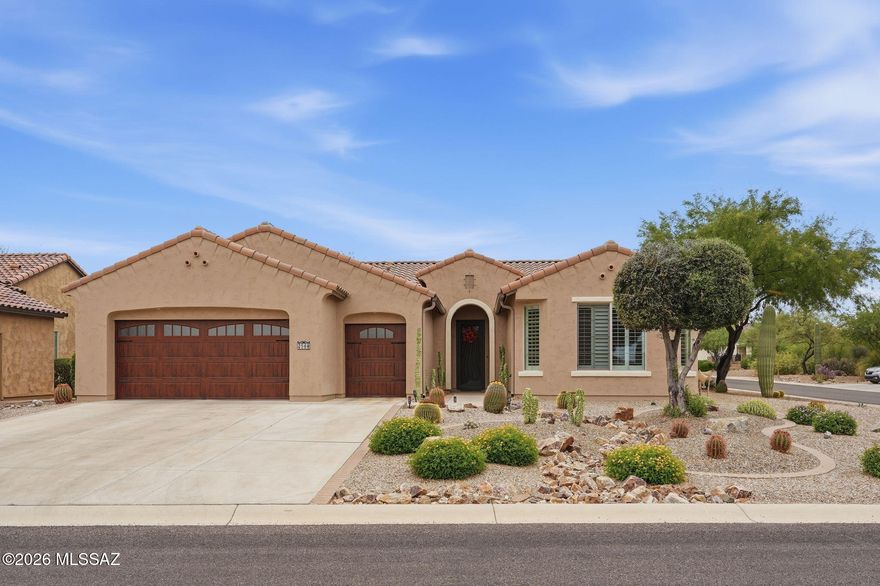 This spacious Cortez model offers 2,111 sq. ft. of living space featuring polished tile floors, high ceilings, and plantation shutters throughout. The kitchen comes equipped with high end appliances, while the master suite includes a walk-in shower, a walk-in closet, dual sinks and upgraded countertops. The secondary bedroom has its own private bathroom and a generous closet; both bedrooms are enlarged with bump outs, adding extra square footage. The home boasts a split floor plan, a well-sized office, and a third guest half bath. The private backyard is beautify landscaped and has a fully enclosed patio/Arizona room, which is complemented by an additional outdoor patio and a mini putting green. The extended garage accommodates large trucks, and also has a separate golf cart garage.