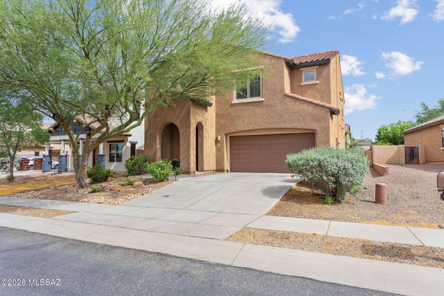 Welcome to this beautiful two story home in the highly sought after Rancho Sahuarita community. With 2,250 sqft this split 4bd/2.5ba home blends comfort, style & functionality. Inside, travertine and warm laminate flooring create a refined, inviting feel. The spacious loft is ideal for a media room, office or extra living space. Enjoy a serene backyard with lush grass and mature vegetation perfect for relaxing or entertaining. Solar panels will be fully paid off at closing offering energy savings. Residents of Rancho Sahuarita enjoy a lake-park, trails, a clubhouse with a gym, meeting rooms, pools and a splash park with waterslides and over 320 annual events all in your backyard!