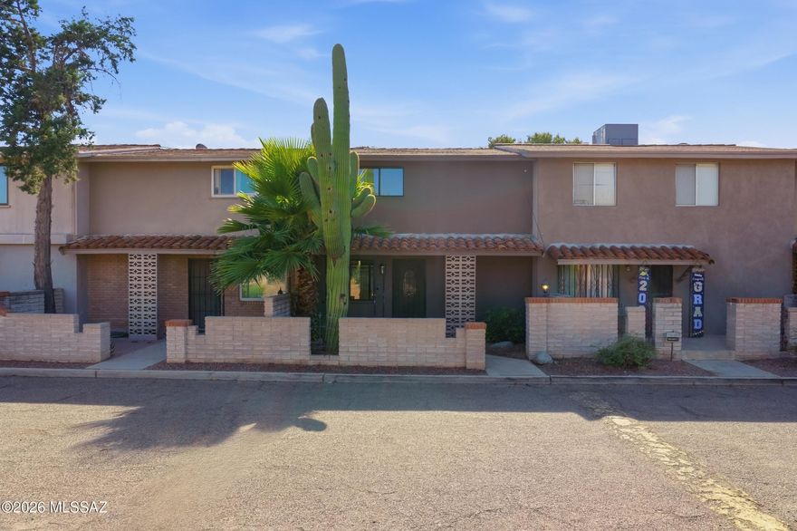 Cool little Rolling Hills townhome loaded with character and charm. Open floor plan with bedrooms downstairs and Kitchen upstairs. Clean and move in ready, fresh paint, new carpet. Close to schools and shopping and easy commute to downtown and U of A.  Nice community pool and membership to Rolling Hills Golf Course is possible. Granite counter tops, Saltillo tile, two covered parking spaces. Owner/Agent