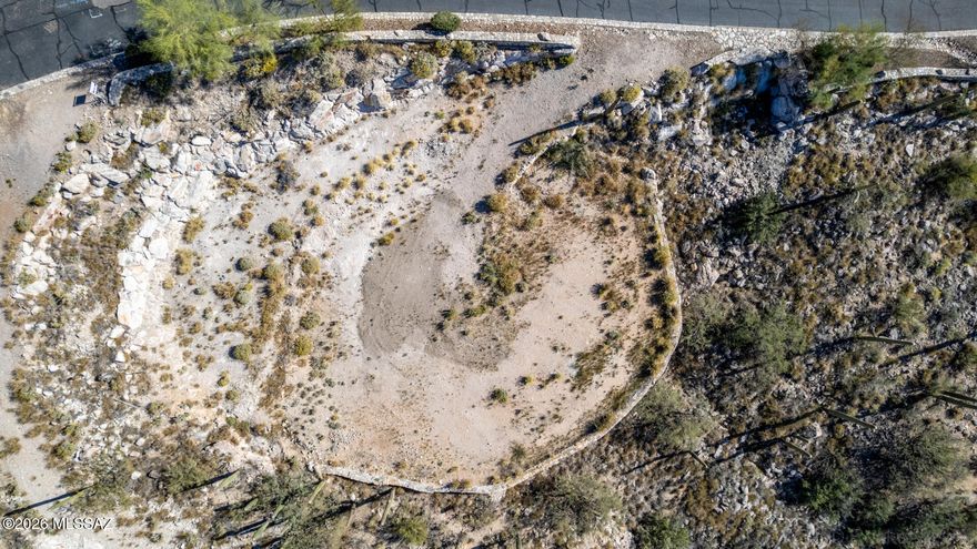 UNBELIEVEABLE VIEWS!  This awesome lot is perched in the prestigious gated enclave of The Summit at Finger Rock.     Soak in sweeping panoramic vistas that shift beautifully from glowing sunrises over the mountains to incredible sparkling city lights and dramatic desert sunrises and sunsets.  This incredible lot offers a rare blend of privacy, elevation, and natural beauty.  Enjoy quick access to Finger Rock trails, and upscale dining and shopping just minutes away at La Encantada. All essential utilities, including sewer, water and power are at the lot.  Don't let this incredible READY TO BUILD value pass by! Make this yours today!