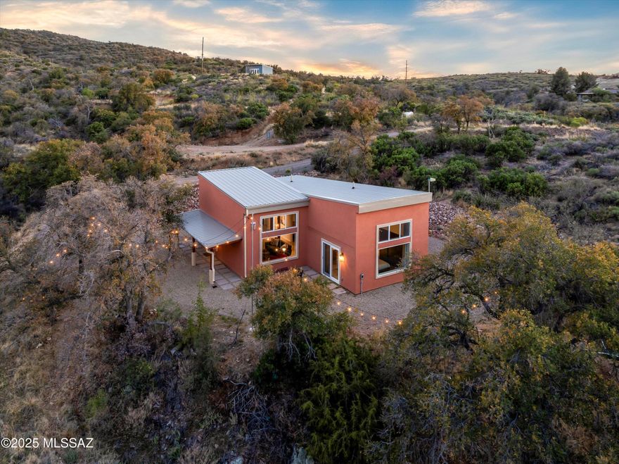 Breathtaking Views, Modern Comforts, and Room to Grow - 6 Acre Retreat in Oracle Endless possibilities and jaw-dropping views await you at this beautifully updated and fully furnished 3-bedroom, 2-bath contemporary home nestled among mature oaks on a private 6-acre paradise. Whether you're seeking peace and privacy or space to expand, this property offers it all—including an additional building pad and a stunning hilltop studio with panoramic 360° views—perfect for sunset watching or stargazing in Oracle's renowned dark sky community. Step inside and experience high-quality craftsmanship throughout, from the pine tongue-and-groove ceilings and quartz kitchen countertops to the center island with induction cooktop, modern gas fireplace, and updated bathrooms. Expansive dual pane windows and vaulted ceilings invite the outdoors in, flooding the home with light creating a bright and welcoming space. Site pad for Amateur Observatory site ready to go. Major upgrades include:New HVAC system,New metal roof & gutters, Upgraded stucco exterior,New bee-hive gas fireplace, Freshly graded & graveled driveway with riprapped hillside, Covered front porch and new paver walkways.
Enjoy all the benefits of Oracle living: 4,500' elevation, cooler temps, no HOA, and endless hiking and biking trails right nearby. With room for horses, guests, an observatory, or your own private retreat, this is the ultimate combination of comfort, beauty, and freedom.This is more than a homeit is a lifestyle. Come see it today.