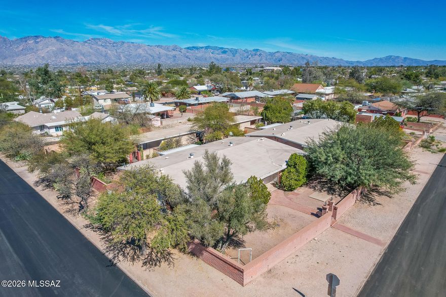 AMAZING investment opportunity. Perfect for owner occupant. Two pride of ownership mid-century duplexes in a wonderful area consisting mostly of single family homes. Located approx. 1 mile from the U of A and Bannner-University Medical Center. Spacious Mid-Century 2 BR units with 1196 sqft living area each. Most units have updated kitchens, updated bathrooms, tile floors, washer and dryers. Large walled front court yard. Large walled north facing rear yards with covered patios. Secure gated entry for tenants with covered parking, concrete driveway and ample parking. Roof to be serviced by Hallmark with 2 year warranty. Expenses are actual (average over last 2 years). The  new entry gate (cost $11,215) was not included in average. Tenants pay gas and electric . Owner pays the water.