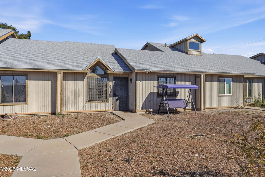Single-story townhome offering an excellent opportunity for first-time buyers or anyone seeking low-maintenance living in central Tucson. This 2-bedroom, 2-bath home with 1,072 sq ft features vaulted ceilings that create an open and airy feel in the main living area. The functional floorplan provides comfortable living spaces and well-sized bedrooms, making the home feel larger than its footprint. Hard surface flooring throughout means no carpet and easy maintenance. Convenient nearby parking adds everyday practicality. Affordable price point at $210,000 makes this a great alternative to renting. Centrally located with easy access to shopping, dining, schools, parks, and major roadways, making commuting and daily errands simple.
