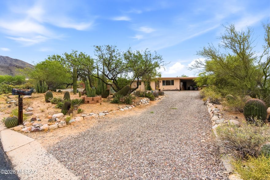 This spacious 4 bedroom, ranch style home tucked away on a peaceful, private .83 acre lot provides the perfect setting for enjoying vibrant sunsets, spectacular mountain views and peaceful desert living! The extra large den provides plenty of room for hobbies, office, library, exercise or extra guest bedroom space! There are two master suites with one having its own HVAC unit. Other features include a large, bright kitchen with lots of cabinets and breakfast bar, workshop, Conex storage box outside. 

Live within minutes of the area's premier hiking and biking trail, while maintaining quick access to restaurants, shopping, hospitals!
