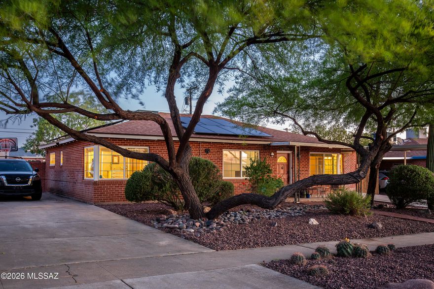 This thoughtfully updated 4-bedroom, 2-bath home with pool offers a seamless blend of comfort, function, and style. The renovated kitchen opens naturally to the dining and living/great room areas, creating an easy, connected living space, with an adjacent office and added Arizona Room extending the home's versatility.

The kitchen is well-appointed with attractive granite countertops, a generously sized island, maple cabinetry with soft-close drawers, and stainless steel appliances including a five-burner cooktop, oven, and microwave.

Both bathrooms have been fully updated, and new lighting throughout enhances the home's warm and inviting feel.

The Arizona Room serves as a flexible multi-purpose space, finished with Saltillo tile floors and large casement windows that look ou over the rear garden with mature trees.

The backyard also features two sizable sheds--one larger structure equipped with a cooler. Large gates open to the alley, offering convenient access and additional functionality

Ideally located, many everyday amenities are within walking distance, including Park Place Mall, with a nearby park offering a pool, tennis courts, dog park, and baseball fields.