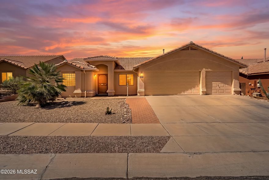 No HOA here! Fantastic Rita Ranch location. This well-designed, inviting southwest contemporary home features a desirable split-bedroom floor plan, offering privacy and flexibility, along with a spacious 3-car garage. Large primary suite includes a generous walk-in closet, updated bath and separate entrance to back patio. Other features include vaulted ceilings, easy-care flooring, and plenty of natural light. Open concept kitchen offers stainless steel appliances, large island with bar seating, pantry closet, and breakfast nook. Generous covered patio spaces overlook a fenced pool and expansive yet low-care backyard, perfect for enjoying Arizona's outdoor lifestyle. Excellent location in the award-winning Vail School District!