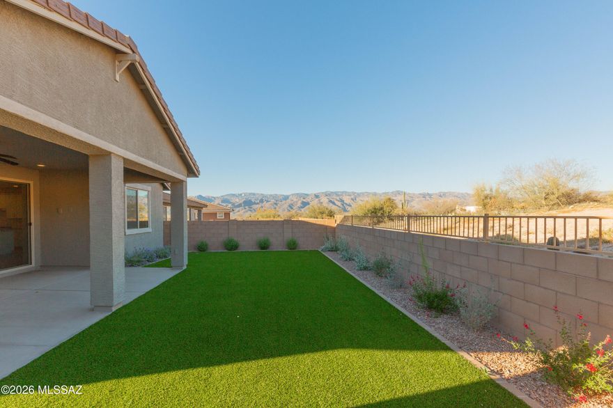 Welcome to modern luxury in the exclusive gated community of Houghton Reserve. This thoughtfully designed 4-bedroom, 3-bathroom home perfectly blends comfort with sophistication. The heart of the home is an expansive open-concept layout featuring a spacious kitchen equipped with a large island and a generous walk-in pantry--ideal for hosting gatherings. Guests will feel right at home in the private secondary bedroom with an adjacent full bath. Retreat to your private primary suite, offering a serene escape with dual sinks and a large walk-in closet.  Unwind in the beautifully landscaped private backyard oasis showcasing desert and mountain views. Featuring energy-efficiency & convenience,  this prime location is just minutes from major employers, shopping, dining and easy access to I-10.