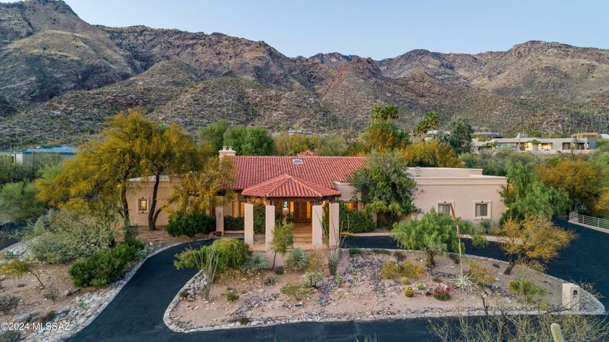 Priced well below the current appraisal, this home nestled in the exclusive 24-hour gated Finisterra in the heart of the Tucson Foothills. A stunning 3-bedroom home offers a perfect blend of luxury and comfort.  The den/office, adorned with a fireplace, complements the formal dining, breakfast area, family room with a fireplace & a gracious formal living room. Gourmet kitchen boasts an oversized fridge, dual dishwashers, wine fridge, and more. Take you pick of primary bedroom, both are private sanctuaries, one with its fireplace and backyard entrance, the other a true spa like bath. A dedicated wet bar area overlooks the backyard oasis. Step outside to a resort-like space with a pool, spa, BBQ, grassy area, & mountain views—perfect for entertaining. Potential for creative financing.