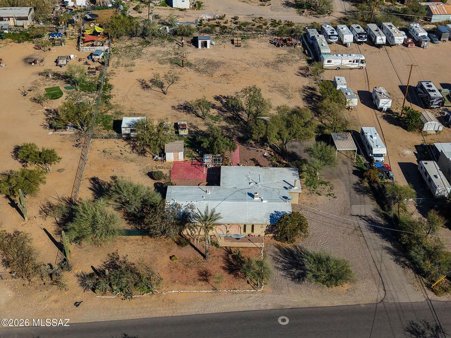 Own your slice of the Southwest with 1.18 acres perfect for buyers craving space, flexibility, and those wide-open mountain views. With room to spread out, this property shines for horse enthusiasts looking to create an arena, corrals, tack/storage areas, and a true ranch-style setup, while still enjoying the convenience of Tucson living.
Need elbow room for your toys, trailers, or equipment? The generous lot size offers incredible potential for RV/boat parking, a workshop, and storage options (buyer to verify intended use with Pima County). Larger lot offers flexibility that attracts a broad range of buyers—think multi-generational living, creative land use, and the freedom that comes with a large-lot homestead lifestyle. 
Close to I-19 and major shopping