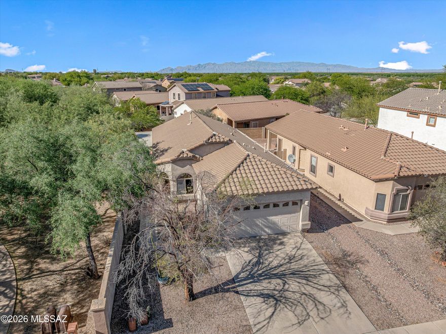 Charming single-story 3-bedroom, 2-bath home just one block from Sahuarita Lake in the Rancho Sahuarita master-planned community. Ideally located near the clubhouse and trails, this home welcomes you with soaring ceilings and abundant natural light. The kitchen features a pantry closet, ample cabinetry, and generous counter space.  Newer microwave and dishwasher (2025) stove (2022). Washer and dryer (2025) The spacious living room accommodates plenty of comfortable furniture.  The primary suite offers vaulted ceilings, a walk-in closet, and a walk-in shower. Two guest bedrooms share a full bath with a relaxing jetted tub. Additional highlights: HVAC 2020, hot water heater 2021, newer front door 2024. Rancho Sahuarita is a vibrant community with top-rated schools, multiple pools/spas, a gym, and miles of walking trails, plus easy access to shopping, dining, and I-19 for a convenient commute. With over 350 events a year, it's a welcoming, active neighborhood.