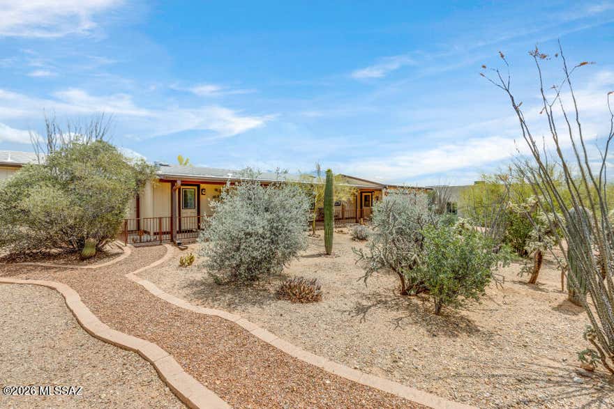 Very nice totally renovated and upgraded ground set home situated on 2 lots with 3 bedrooms and 3 bathrooms. Large decks on the front and back of home with great views. This home includes an oversized 24x26  two car garage with workshop space. Ample windows and glass doors provide ample viewing from inside the house. The living room boasts a warm electric wall fireplace. This home includes a whole house water softener, PEX plumbing, recent interior and exterior paint, and a newer roof. Don't miss this quality home. Very active gated community with nice amenities including pool, spa, tennis, pickleball, bocce ball, and much more.