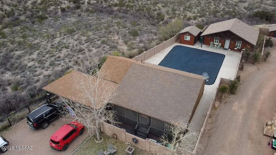 Welcome to a rare opportunity on Historic Allen Street in the legendary ''Town Too Tough to Die.'' This unique property offers space, versatility, and breathtaking high-desert scenery on over ¾ of an acre, providing room to live, work, and unwind in one of the most iconic settings in the Southwest. The 1,124 sq ft main residence features 2 bedrooms and 2 bathrooms, blending comfort with character and plenty of stunning surrounding mountain and hill views. Just steps away, a separate 624 sq ft guest house/ADU (currently running as a vacation rental) Built in 2020, with 1 bedroom and 1 bathroom provides ideal accommodations for guests, extended family, rental income, or a private retreat. Designed with flexibility in mind, the property also includes a separate outdoor office building with electricity and a shed.