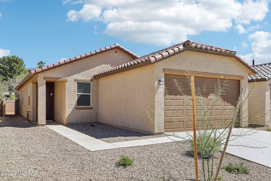 This home is open for self-guided tours daily 8 am - 8 pm. This gorgeous, single-story home showcases an open floor plan with 9-ft. ceilings and stunning mountain views. Whip up culinary delights in the modern kitchen, which boasts white cabinets, granite countertops, a gas range, an island, pantry  and Whirlpool® appliances. The primary suite features a walk-in closet and connecting bath that offers a 42x60 cultured marble shower and extended dual-sink vanity. The covered back patio provides the ideal setting for outdoor entertaining and leisure. Ask about interest rate promotions. Price includes discount predicated on using seller's preferred lender KBHS. Property taxes are not available to date.