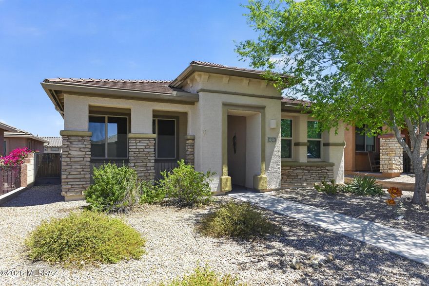Beautiful well cared for original owner home at a great affordable price in 55+ community of Del Webb at Rancho del Lago. Hard to find 3BR in this popular Sonoita model. The facilities here are outstanding along with our higher elevation and cooler temperatures. Newer heating & cooling units. Owned Solar keeps electric costs low. No wasted space in this cozy floorplan w/tile everywhere except carpet in Primary BR & Bamboo flooring in Living Room. Garage has epoxy flooring & built in Cabs for extra storage. Kitchen is fantastic w/pull outs in cabinets, granite countertops & built in buffet & computer desk. Front BR has built in book case. Side patio w/built in BBQ & Fridge, Pavers Pergola ramada, & attached WIFI controlled speakers included. This is a super home at a fantastic price!