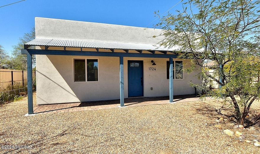 LIKE NEW-BUILT IN 2023 and LESS than 2 Miles to Downtown and 3.5 Miles to the University of Arizona! This Well-Maintained, ORIGINAL OWNER Single-Story Home Boasts 4 Bedroom's, 2 Bath's, and is COMPLETELY ENCLOSED with a LARGE Remote Controlled Electric Gate. You'll find NUETRAL Designer Paint, CERAMIC TILE Throughout, and the Refrigerator, Washer and Dryer ALL Convey!  The Gourmet Cook's Kitchen, that is both MODERN and INVITING, includes Granite Countertops and Stainless-Steel Appliances. The Owner's Suite is complete with a Private En-Suite.  Backyard with Covered BRICK PAVERED Patio, Lots of Natural Desert Cactus & Plantings, makes this a PERFECT place to Relax, Enjoy, and Entertain. All this Nestled in a Convenient CENTRAL Location close to Everything! WELCOME HOME!!!