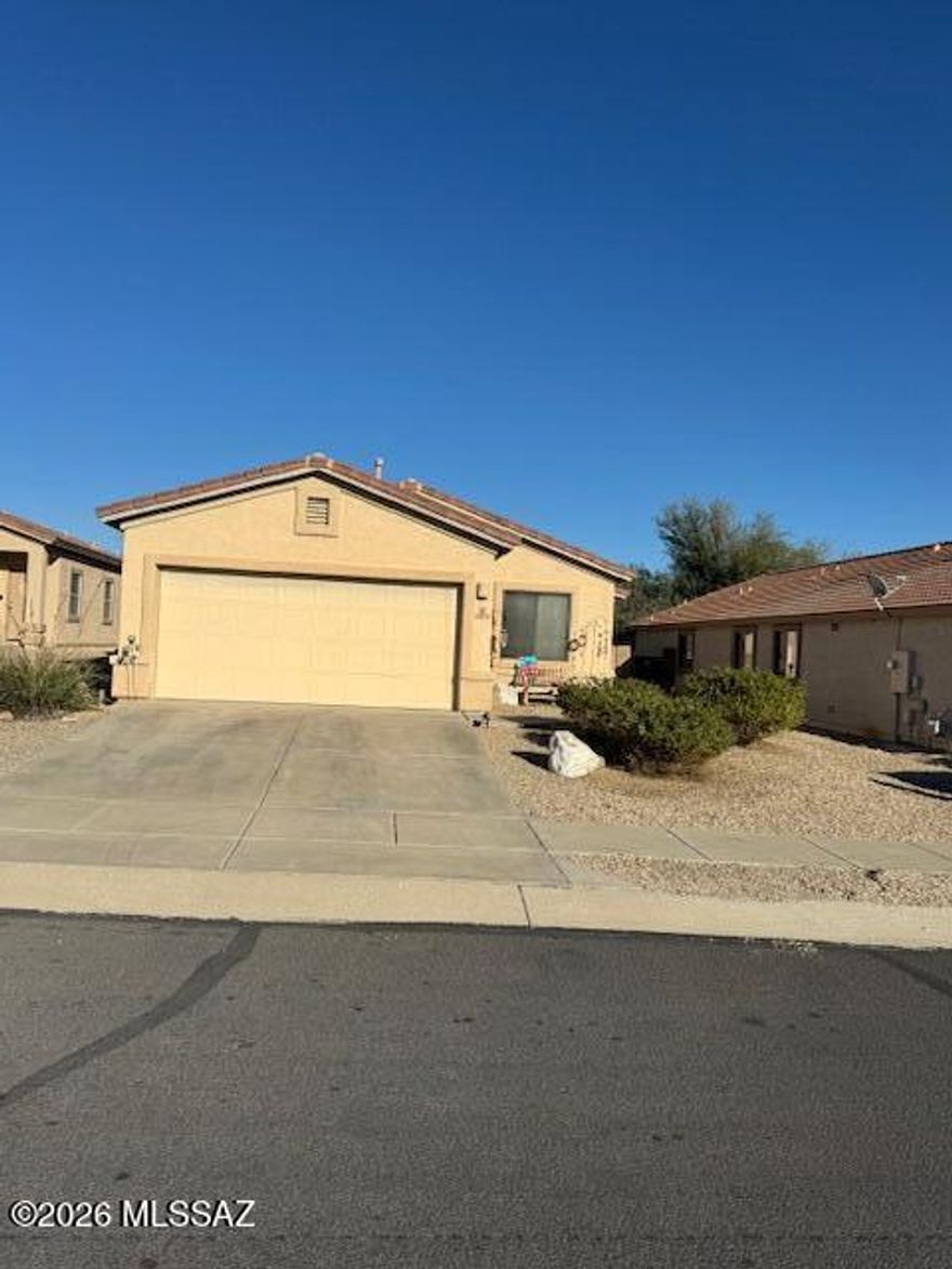 Possible 3rd Bedroom with large den. Location is the thing.  Its great.  In the Villages at Dove Mountain, End of cul-de-sac lot with east facing rear yard with masonry fencing backing to common area. Close to shopping, A myriad of hiking, biking trails surround with gorgeous views to enjoy.  Low traffic on pretty street.  Large Master with walk-in closet, separate shower, garden tub. Split Bedroom with Dbl doored Den and 2nd Bedroom on other side of home.. Huge utility room sith space for a frige.  Kitchen has beautiful cabinets, granite counters, new stainless dishwasher, great gas stove and frige.  Lg dining area with Patio door leading to nice covered patio.  Neutral ceramic tile.  Lovely great room with plenty of windows,  Large neighborhood park short way away w/dog park & play yard
