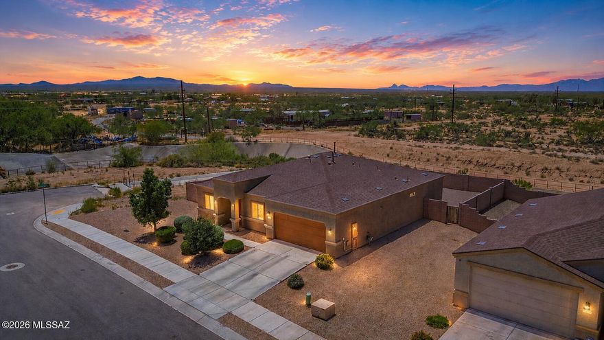Discover comfort, space, and value in this beautifully maintained 4-bedroom, 2-bath Arizona stucco home located in desirable Southwest Tucson. Designed with both functionality and style in mind, this newer home features an open-concept floor plan with spacious living areas, tile flooring throughout the main living spaces, and cozy carpet in the bedrooms. The split-bedroom layout offers added privacy, making it ideal for families or guests.Situated on a premium corner lot, this property offers exceptional privacy with no neighbors to the rear or on the left side of the home. Enjoy peaceful desert living away from the hustle and bustle of the city, while still being conveniently close to shopping, schools, parks, and everyday essentials.Built with a proven and durable construction style, this home delivers modern comfort at an outstanding value. Plus, you're just minutes from some of Tucson's most popular dining, entertainment, and recreational destinations.If you're looking for a newer home that combines privacy, convenience, and affordability, this Southwest Tucson gem is a must-see!