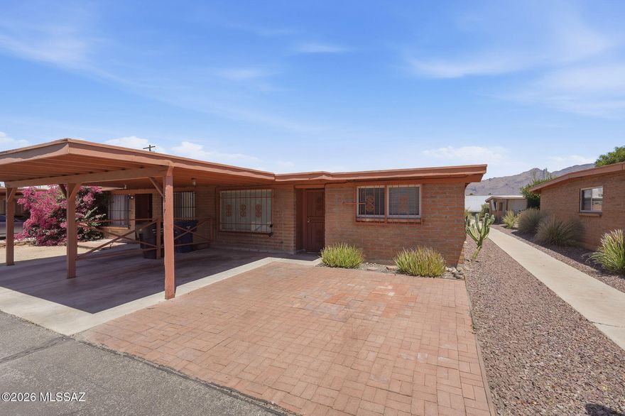 Charming 3-bedroom, 2-bath, 1,121 sq ft townhome in central Tucson. Features a great room, dining area, spacious bedrooms, tile flooring, ceiling fans throughout, and in-unit washer/dryer. Enjoy a private, low-care patio, security doors/bars, and single covered carport. Community offers a playground and pool. A very well-located home near shopping, dining, and transportation.