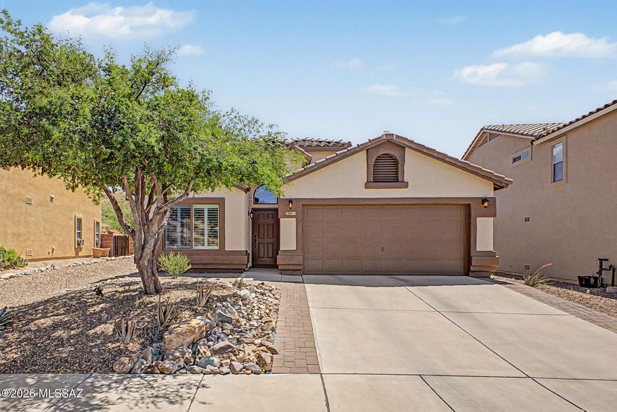 Beautifully maintained and spacious, this move-in ready home backs to natural open desert with no front or rear neighbors, offering exceptional privacy and scenic tranquility in the desirable community of Eagle Crest Ranch. Soaring vaulted ceilings and over 1,760 sq. ft. of thoughtfully designed living space create an inviting and airy atmosphere throughout. The home welcomes you into a generous living room that flows seamlessly into a warm family room and open-concept kitchen, complete with Samsung stainless steel appliances installed in 2025, quartz countertops and a convenient island with breakfast bar seating. The private primary suite features an en suite bathroom with dual vanities topped in quartz, an upgraded shower and a large closet.  Major upgrades have already been completed, including an American Standard 14 SEER HVAC system installed in 2025, Samsung washer and dryer in 2025, fresh interior and exterior paint in 2026, an expanded driveway, recessed lighting, teak wood ceiling fans, hickory engineered wood flooring by D&M with 5-inch baseboards, plantation shutters and Hunter Douglas honeycomb shades. The professionally landscaped and irrigated front and backyard enhance the home's curb appeal and ease of maintenance. Step outside to a peaceful backyard retreat featuring a relaxing covered patio, a tranquil water feature and an expansive 450 square foot brick patio, all set against a stunning backdrop of open desert. This exceptional home offers comfort, quality and an unbeatable setting.