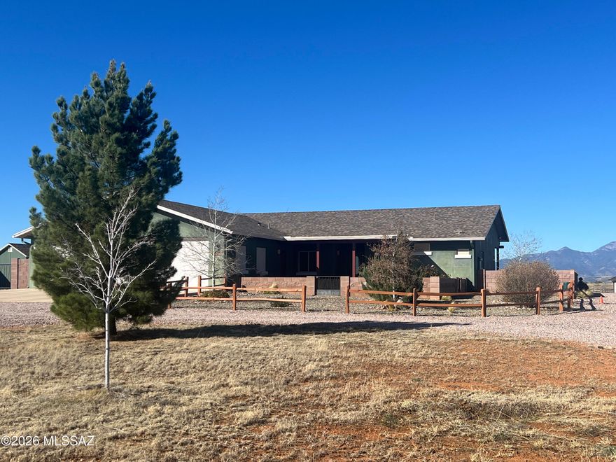 Turn Key Horse Property!! This meticulously maintained 2339sqft 2 bedroom, 21/2 bath 2014 custom home on 9.72 acres features: Open floor plan with spacious kitchen, stainless steel appliances, granite countertops with plenty of space for baking/entertaining, alder cabinets, walk in pantry, breakfast bar, dining area with views of the Santa Rita mountains, cozy great room with pellet stove, office/den/craft room, split floor plan, provides 2 spacious master bedrooms with exterior entrances that are ensuite, walk-in closets, custom tile showers, main master has a 2  head shower and a double sink vanity, large laundry room, guest bathroom, oversized 3 car garage (truck deep), water softener, reverse osmosis system under kitchen sink, central vac, utility sink in garage. Let's go outside! Beautiful low care landscaped back and front yard, covered porches, waterfall feature, shed in yard, irrigation system, pavers, flowers, trees, block wall, decorative rock and gravel. Horse facilities include 3-stall MD metal barn with runs, separate tack and feed rooms, pavers, wash rack, perimeter fenced with cross fenced pastures for turn out and rotational grazing, riding arena with lights built with base layer and washed sand for the ultimate footing! Did I mention it has lights! 800 sqft shop building with walk through and roll up doors, 15' X 40' RV garage with 14' roll-up door, well house encloses the private well, pressure tank, filter system, back-up generator and additional work/storage space. Beautifully landscaped with flowering plants and fruit trees all on low care irrigation system. Surrounded by 360 degree views of mountain ranges, clear sky, miles and miles of riding trails, mild year round climate. Completely turn key! Move in and start enjoying!