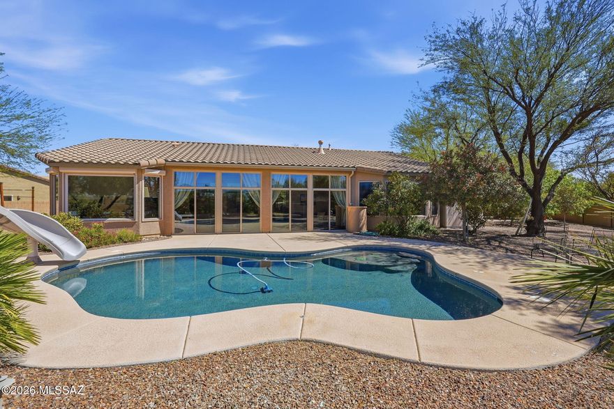 Welcome home to this move-in ready 5-bedroom, 3-bath home in Rincon Trails! Situated on .51 of an acre with no rear neighbors, this property offers space, privacy, and room to enjoy the outdoors. Step into the backyard oasis featuring a sparkling pool, a seating and barbecue area perfect for entertaining, and an enclosed patio that provides additional outdoor living space. With plenty of room inside and out, this home is ideal for relaxing, hosting, and enjoying Arizona living. Come see everything this property has to offer!