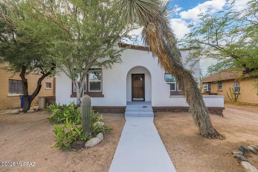 Charming historic property in the desirable Feldman's neighborhood near the University of Arizona, 4th Avenue, and downtown.  The updated main home features 4 bedrooms and 2 baths with modern upgrades while preserving the classic character.  A detached 2-bedroom guesthouse with private entrance and alley access offers excellent rental or multi-generational living opportunities.  Spacious lot, outdoor living areas, and a prime central location make this a fabulous find!