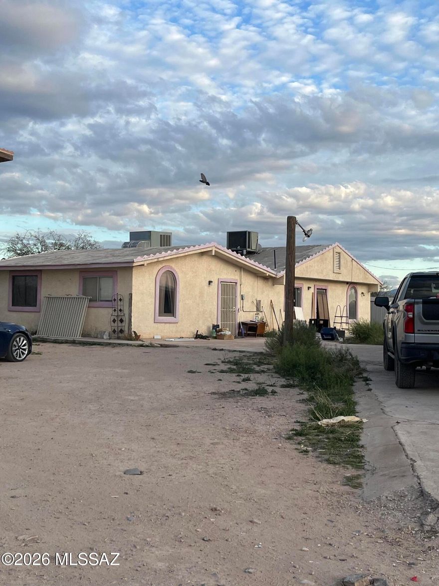 No HOA on this .98 acre lot 4 bedrooms and 1 Full bath and a quarter bath, Tile throughout the house. sold as-is with lots of potential needs some TLC. Plenty of storage/shed space. Also included is a 1999 manufactured home that also conveys.
Portico on the entrance. Great for those who enjoy raising animals, having horses, also enough space for toys.