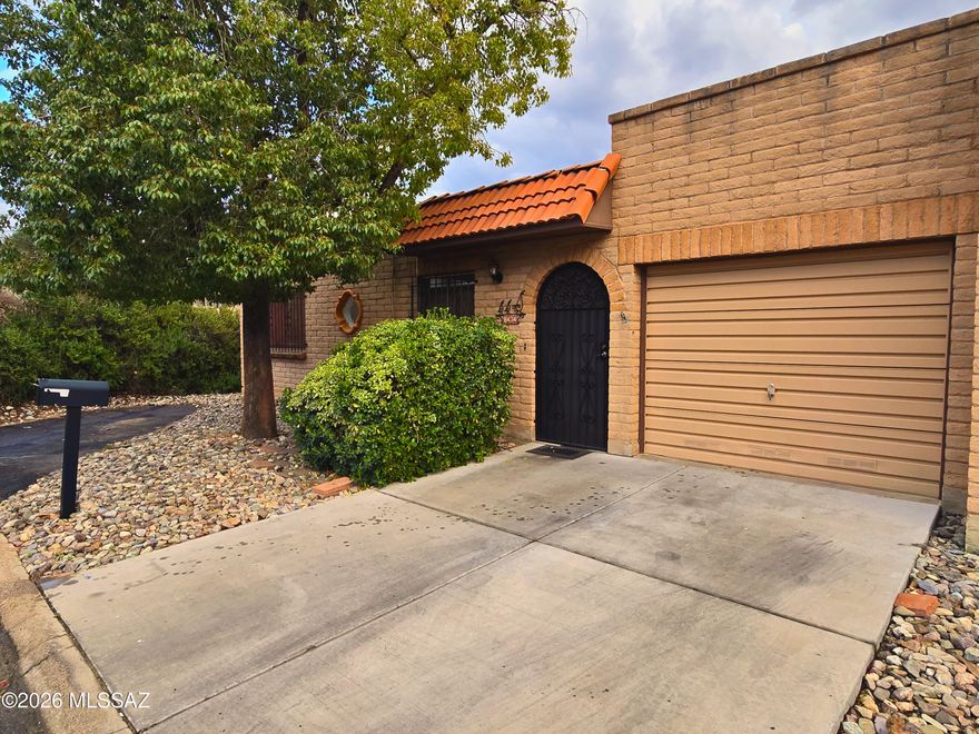 NEW PRICE! Welcome to picturesque and desirable Rolling Hills Villas! This charming 2 bedroom, 2 bathroom home offers a bright and open layout with a spacious living room perfect for relaxing or entertaining. Located at the end of a secluded road. Freshly painted interior walls. Enjoy seamless indoor, outdoor living with three separate sliding glass doors leading from the private courtyard into the dining area, living room, and primary suite, filling the home with natural light and an airy feel. The extended length 1 car garage provides extra space for storage or a work area. HOA features swimming pool and hot tub! Located near Rolling Hills Golf Course, shopping, and dining, this is low maintenance living in a prime location!