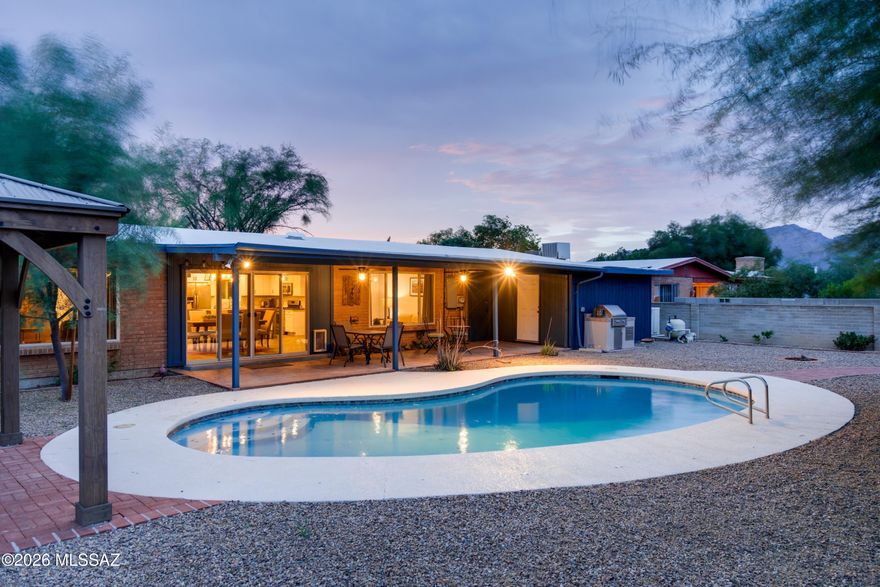 Move in and relax. This corner lot home with Mtn views has quality finishes throughout. The updated kitchen features a custom mesquite island, gas range, quartz countertops, farmhouse sink, and custom backsplash. The open space of the kitchen, dining, and living room flows out onto the shaded patio and fresh pool, making a year-round retreat. A separate family room offers flexible living space, and both the ensuite primary and 2nd bathrooms are fully updated. The current owners' upgrades: heat pump package HVAC, pool pump and heater, replastered pool, upgraded electrical, gas water heater, smart thermostat, drip irrigation system, under-sink water filter, and a roof re-coat in March 2026. Fully fenced backyard, built-in BBQ, gazebo, and brick patio. 2-car garage with workspace and storage.