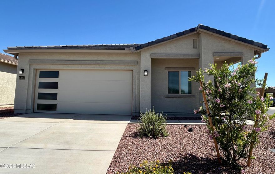 The Payson plan boasts a spacious 4-bedroom, 2-bathroom layout that's designed for comfort & togetherness. As you approach this home, the eye-catching exterior details, featuring a stylish tile roof, contemporary coach light, and a charming ¾ lite front door, set the tone for what awaits inside. Step through the door and be enchanted by the seamless flow of the Payson floor plan. A chef-ready kitchen takes center stage, overlooking the expansive dining area & inviting family room, creating the perfect space for gatherings & everyday living. When it's time to extend the celebration outdoors, you'll appreciate the generous covered back patio & the serenity of your private back yard. It offers a harmonious blend of style & functionality, making it the ideal residence for you and your family.