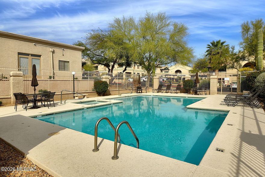 Welcome to the highly desirable community of Moonrise at Starr Pass! Nestled within one of Arizona's most breathtaking desert landscapes, this beautifully maintained ground level move-in ready condo is infused with natural light & nature's beauty while offering numerous modern conveniences. The open floor plan is perfect for today's active lifestyle featuring a great room with beautiful laminate flooring, wood burning fireplace, access to the covered patio and adjacent to the dining area. The kitchen features granite countertops, stainless steel appliances, water filtration system, breakfast bar and plenty of cabinets & counter space. Retreat to the spacious primary suite with ensuite offering a sleek glass shower enclosure & large closet. Secondary bedroom could also double as an office. Enjoy year round entertaining and outdoor dining on the private covered patio while immersing yourself in the beauty of the Sonoran Desert with its lush vegetation, cacti and natural wildlife. This resort style community features a refreshing pool, relaxing spa, tennis court and a fully equipped fitness center. HOA dues cover water, sewer, trash, exterior maintenance and all common areas-allowing you to enjoy a truly low-maintenance lifestyle. Close to JW Marriott Resort (with resort privileges), University of Arizona, Pima Community College, Tucson Mountain Park, Saguaro National Park West, the world-renowned Arizona-Sonora Desert Museum and Downtown Tucson with its great restaurants & shopping. Perfect as a full-time residence, winter retreat or an investment property.  Luxury living at its best!