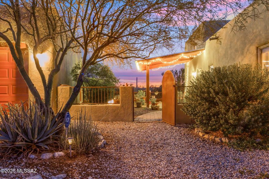 Mountain Views with Amazing Sunsets, surround by a Serene Ambiance of Natural Beauty of the Sonoran Desert. Pristine Custom Built Santa Fe Style Home is Nestled on 3.3 acres, embrace the tranquility of desert living while envisioning the potential this unique property holds. This spacious open floor plan is warm and functional, 3 bedrooms, 2 full bathrooms, filled with natural light. RV parking with custom build RV shade cover, electric, water, sewer line to septic. Seller has planted Orange, Lime, Lemon, Apple, Grapefruit and Peach trees that are thriving. Look for the Features Write Up in the Documents for all the wonderful things this property offers.