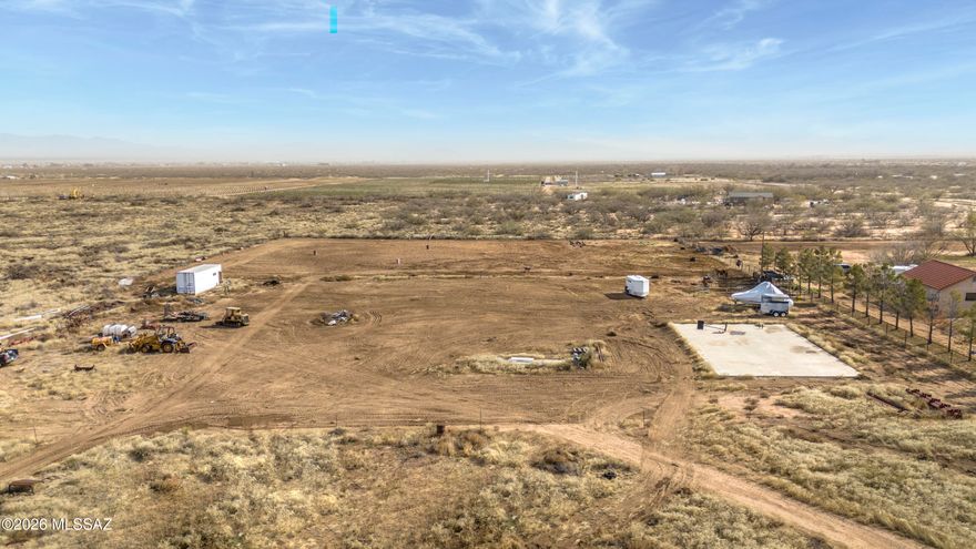 Build your dream Barndominium! ''Some Assembly Required''.  4 acres of flat useable land with beautiful views of Cochise Stronghold. Property includes 1/4 well share, 200 amp electric, septic installed, Concrete pad is poured and ready for a 40X60 Muller Metal Shop that is included (building is not erected).