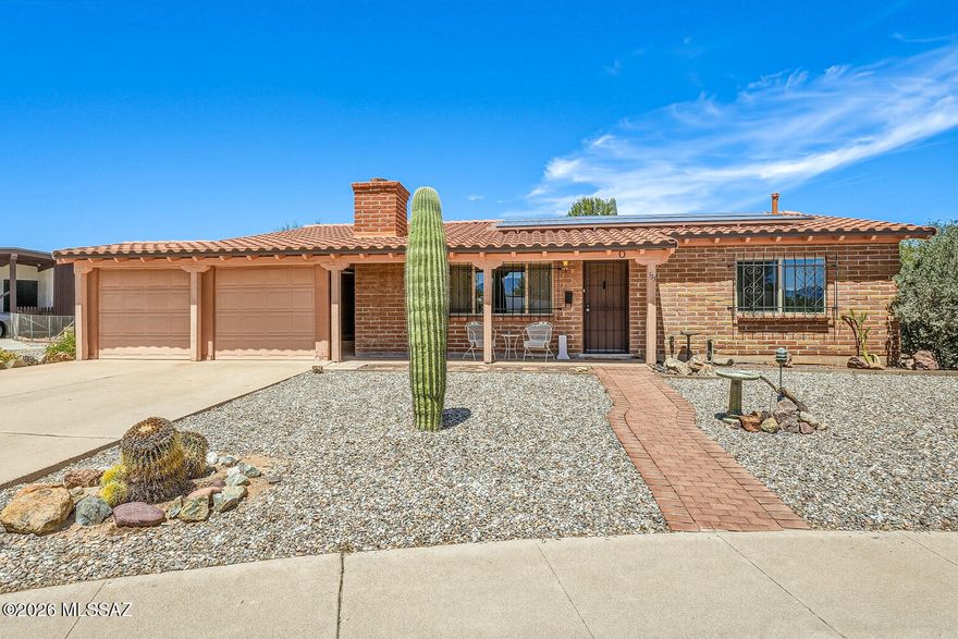 Move right in to this charming furnished home in the well-established Fairways 3 neighborhood.  Situated on a quiet cul de sac with Santa Rita mountain views!   Plenty of room outside on your 1/5 acre lot. Owned solar panels mean low monthly electric bills!  Roads are county-maintained which makes for a very low HOA annual fee of $60!!  Enjoy cozy winter evenings by the brick fireplace in the living room.  The adjoining light-filled Arizona Room could be the tv room or a wonderful art studio!  Separate Laundry room off the Arizona room with plenty of storage.  Also a separate-entry workshop-storage on the back of the home,.  Stunning wood-like porcelain tile in both bedrooms!  Lots of room outside in the back yard for entertaining.  You are linked to the famed De Anza Trail.  Enjoy!