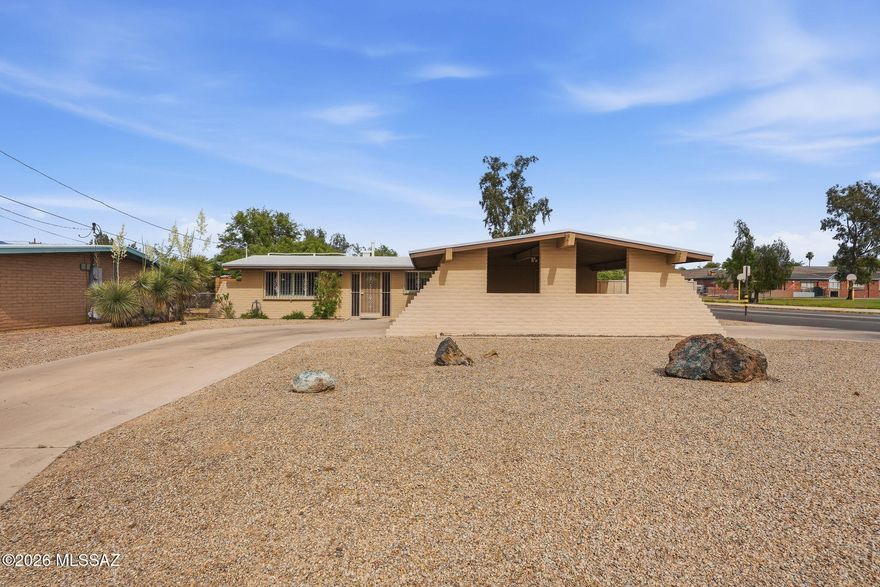 Charming 3BR/2BA ranch style home fully updated for comfortable living. Inside, you'll find durable LVP and tile flooring throughout with new energy-efficient windows and window shutters. The property also features new interior paint, updated light fixtures and appliances, a convenient porte-cochere, and new roof replacement in 2025. The backyard is a private retreat with an extended covered patio, refreshing Pebble Tec pool, flagstone patio, and artificial turf all for easy maintenance. Complete with a built-in BBQ, side yards, and extra storage shed. Located minutes from the UofA, medical centers, and Tucson dining. This move-in-ready home offers the perfect balance of comfort and convenience.