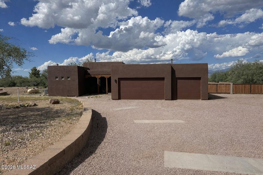 Single story territorial style home with swimming pool and spa. The home sits on nearly 2 acres with horse privileges.
