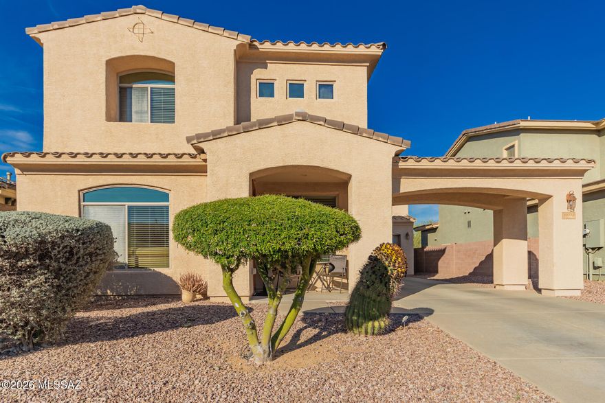 The search is finally over! This stunning residence welcomes you with a 2-car garage, an extended driveway, an inviting porte-cochÃ¨re, and a lovely desert landscape. Discover a serene living/dining room with high ceilings, a soothing palette, blinds, and durable tile flooring. Gather loved ones in the great room, which includes a cozy fireplace for relaxing evenings. The gourmet kitchen comes with solid surface counters, ample wood cabinetry with crown moulding, recessed lighting, SS appliances, a center island, and a peninsula with a breakfast bar. Double doors lead to a sizeable main bedroom, featuring soft carpeting, an ensuite with double sinks, and a walk-in closet. Unwind in the charming backyard, which offers a covered patio and breathtaking mountain views. Make this gem yours no
