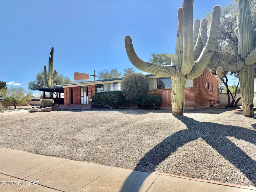 Seller will accept or counter offers between $299,000-$315,000. No HOA. Updated and move-in ready on Tucson's east side, this brick home offers a flexible 3BR layout or 2BR plus den with separate living, dining, and family-room spaces plus a cozy fireplace. Enjoy mountain views from the living room window, and step from the kitchen into the screened Arizona room for comfortable indoor-outdoor living. Recent improvements include new interior paint throughout and an updated secondary bathroom. Out back, the large shaded yard features mature trees and a shed/workshop, with a buffer and direct access backing to Jesse Owens Park. Noted updates include roof (2016), HVAC (2017), furnace (2017), and hot water heater (2021).