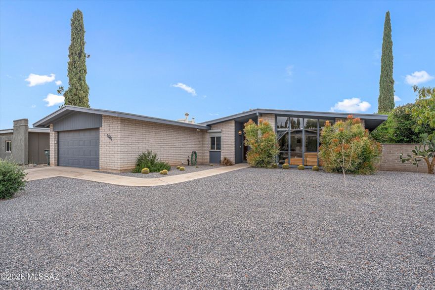 Rare opportunity in Tucson's beloved Rolling Hills community. This 3-bedroom, 2-bath, 1,704 sq ft architecturally significant Mid-Century Modern residence, built in 1969, blends authentic period character with thoughtful modern updates. Clean architectural lines, abundant natural light, and a warm, inviting floor plan create the timeless feel buyers love in classic Tucson MCM homes.The updated kitchen and refreshed bathrooms offer modern comfort while preserving the home's original charm. Multiple living spaces provide flexibility for entertaining, working from home, or everyday living. A 2-car garage, generous storage, and numerous updates throughout add practical function to the home's standout design.  The property features a spacious backyard with mature landscaping and a covered patio creating a private, inviting outdoor setting. The space feels established, functional, and distinctly Tucson. Ideal for entertaining, relaxing, or gardening, with low-maintenance appeal. Located in Rolling Hills - one of Tucson's premier eastside communities. The neighborhood is known for its mid-century homes, mature streetscapes, and proximity to the semi-private Rolling Hills Golf Club. Authentic 1969 MCM charm, updated finishes, natural light, mature landscaping, covered outdoor living, garage, storage and a prime eastside location - this is a must-see home offering character, substance, and everyday livability.
