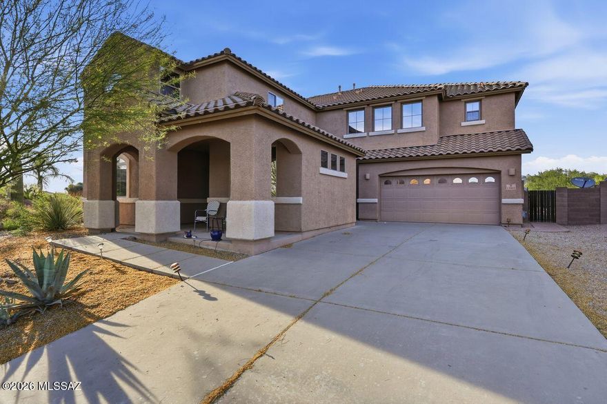 Range priced $690,000-$720,000, this Northwest home in gated Tangerine Crossings offers space, privacy, and a premium lot with no rear neighbors. Featuring 5 bedrooms and 5 bathrooms, four bedrooms include walk-in closets for added convenience and storage. The open kitchen features quartz countertops, pull-out cabinetry, and flows into inviting living areas. The primary suite offers a sitting area, separate vanities, soaking tub, separate shower, and access to an oversized deck with mountain and sunset views. Backyard features desert landscaping, drip irrigation, and a heated, self-cleaning Pebble Tec pool with a color-changing light with remote. Additional highlights include leased solar, dual A/C, water softener, surround sound, fire sprinklers, EV charging, and a tandem 4-bay garage.