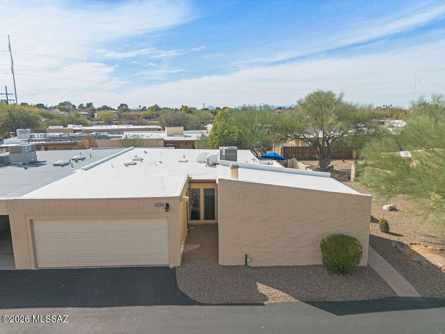What a beautifully updated one-story end unit townhome with a 2 car garage! Gorgeous kitchen and baths with granite counters & luxurious finishes. 16 seer Lennox HVAC heat pump/2022. Energy efficient vinyl windows & sliders. Beautiful tile thruout w/faux wood in 2nd bedroom. Step-in tiled shower in primary w/glass door. Roomy bedrooms. Nice high ceilings with many windows for brightness. Roof newly recoated 2026. Rain gutters. 2 car GARAGE w/extra storage! Lovely conveniently located community near shopping, restaurants & the Loop.