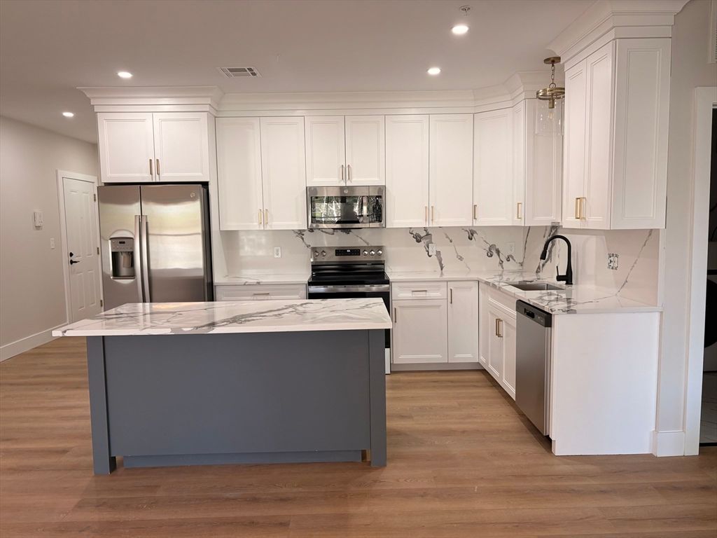 Photo of 441 Washington St #305, Dedham, MA 02026 (MLS # 73503605)