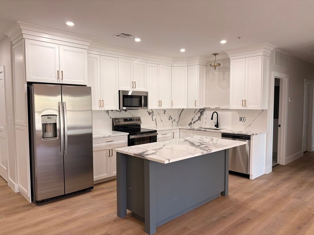 Photo of 441 Washington St #305, Dedham, MA 02026 (MLS # 73503605)