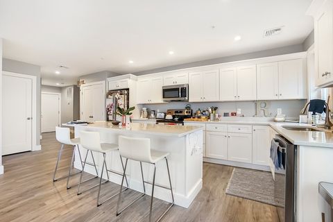Photo of 245 Bussey St #404, Dedham, MA 02026 (MLS # 73527033)