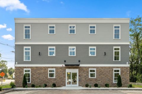 Photo of 7 Cross St #102, Wilmington, MA 01887 (MLS # 73461594)