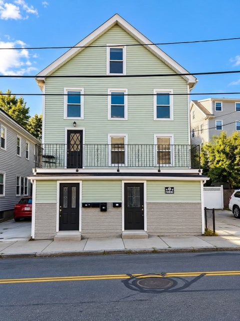 Photo of 321-323 Lawrence St, Lowell, MA 01850 (MLS # 73591960)