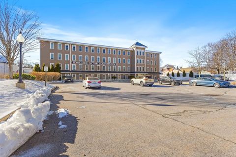 Photo of 110 Pleasant St #401, Marlborough, MA 01752 (MLS # 73461245)