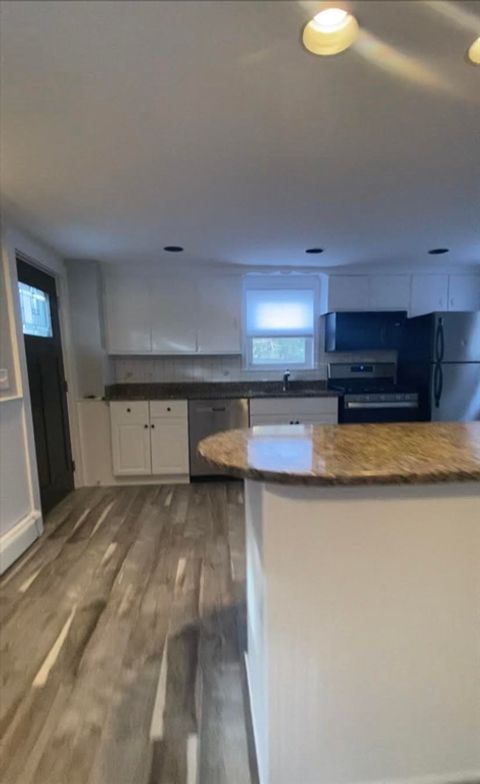 Photo of 15 Webster Pl #1, Newton, MA 02465 (MLS # 73455389)